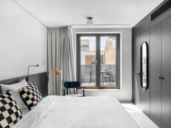 numa I Savi Rooms & Apartments : photo 1 de la chambre chambre double avec balcon