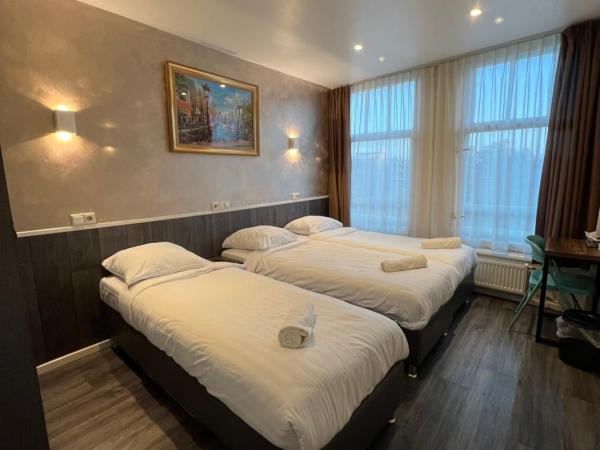 Orange Tulip Hotel : photo 1 de la chambre chambre triple avec salle de bains privative