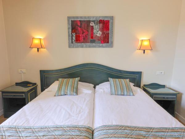 Hotel Saint Christophe : photo 4 de la chambre chambre lits jumeaux standard avec vue sur jardin