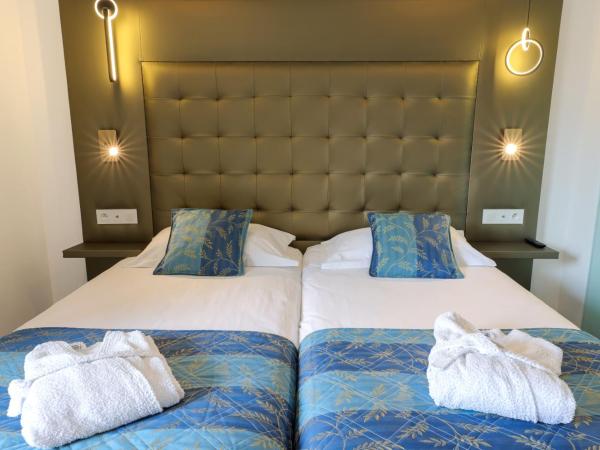 Hotel Saint Christophe : photo 6 de la chambre chambre lits jumeaux supérieure - vue sur jardin