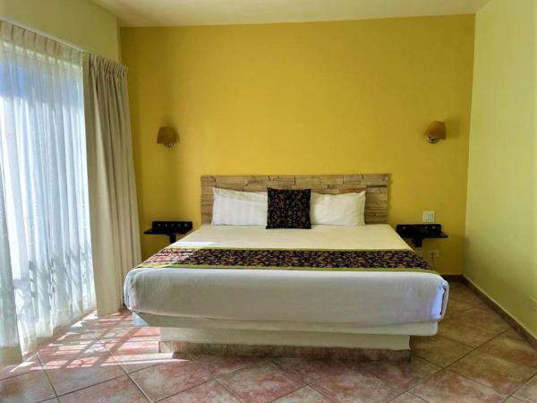 Seven Crown Express & Suites by Kavia : photo 1 de la chambre chambre lit king-size supérieure