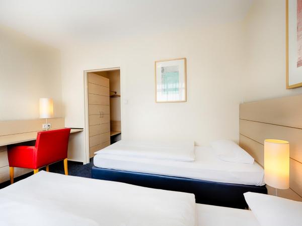 Enjoy Hotel am Studio : photo 3 de la chambre chambre double ou lits jumeaux
