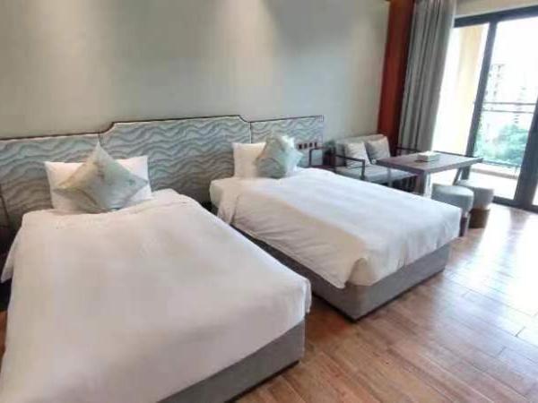 Zhongzhou International Apartment : photo 6 de la chambre chambre lits jumeaux deluxe