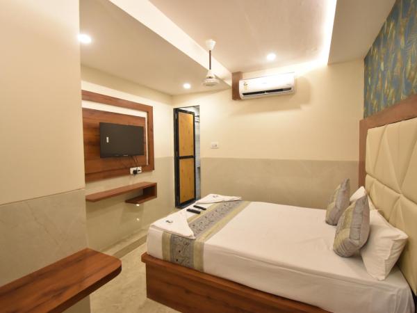 Hotel Dream Palace Residency - Near LBS Marg Kural West : photo 3 de la chambre chambre deluxe