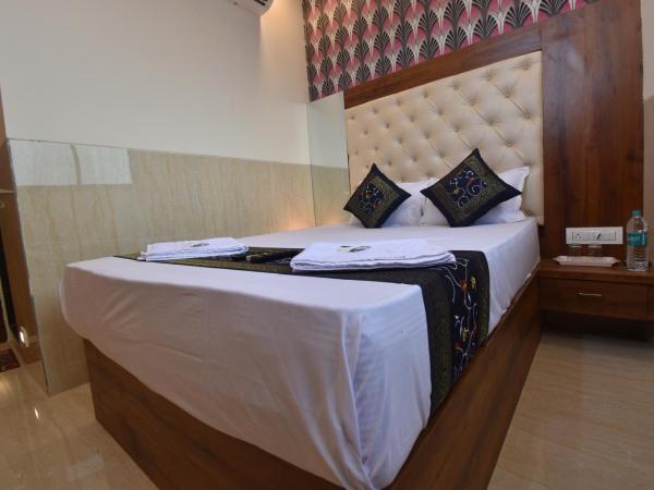 Hotel Dream Palace Residency - Near LBS Marg Kural West : photo 6 de la chambre chambre deluxe