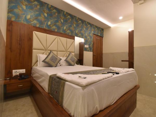 Hotel Dream Palace Residency - Near LBS Marg Kural West : photo 7 de la chambre chambre lit king-size supérieure