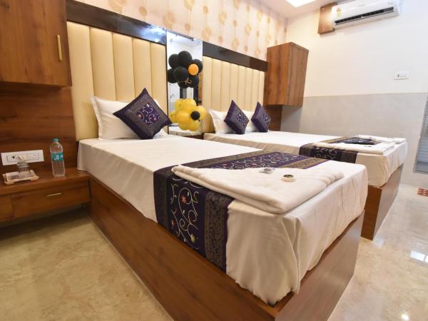 Hotel Dream Palace Residency - Near LBS Marg Kural West : photo 7 de la chambre chambre double ou lits jumeaux