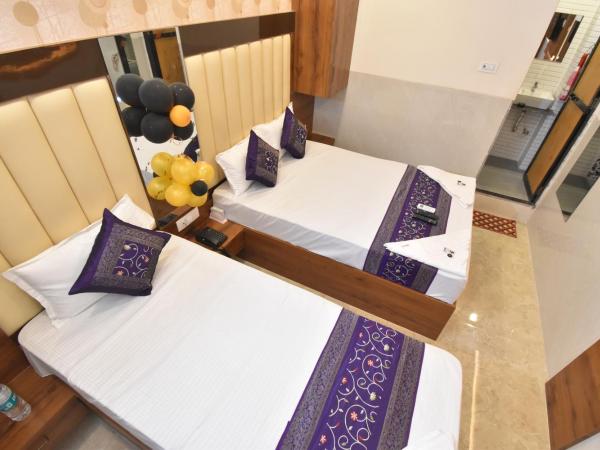 Hotel Dream Palace Residency - Near LBS Marg Kural West : photo 5 de la chambre chambre double ou lits jumeaux