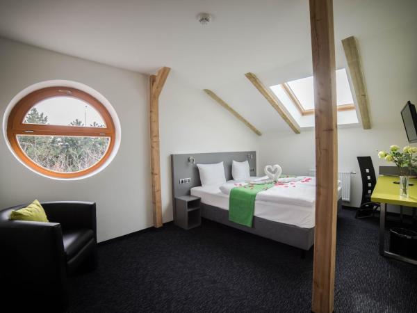 Hotel Herrmes : photo 1 de la chambre chambre quadruple deluxe