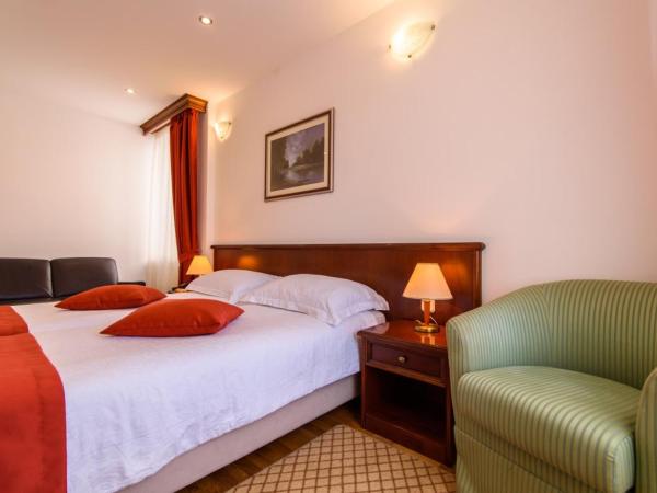 Heritage Hotel Vila Sikaa : photo 3 de la chambre chambre lits jumeaux supérieure - vue sur jardin