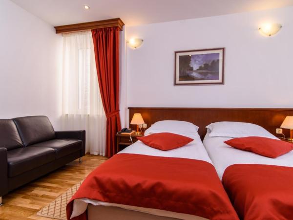 Heritage Hotel Vila Sikaa : photo 4 de la chambre chambre lits jumeaux supérieure - vue sur jardin