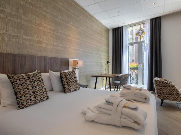 Hotel Amsterdam De Roode Leeuw : photo 1 de la chambre chambre double ou lits jumeaux premium - vue sur ville 