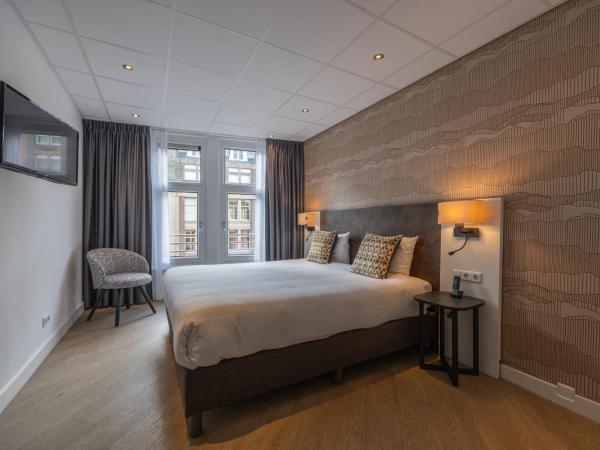 Hotel Amsterdam De Roode Leeuw : photo 1 de la chambre chambre confort double ou lits jumeaux avec vue sur la ville