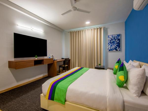 Treebo Jass Hospitality Services - Sec 53 : photo 5 de la chambre chambre double deluxe