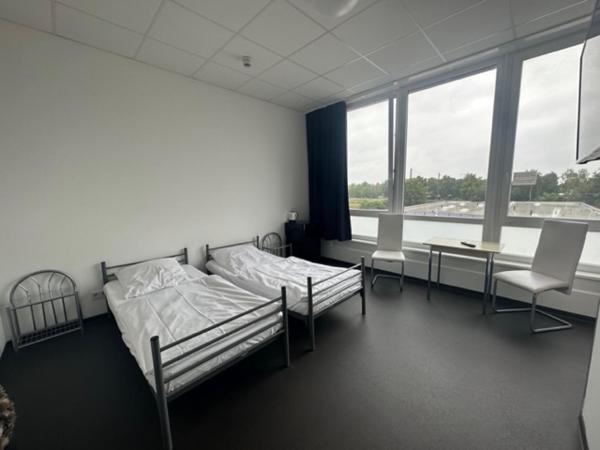 Arena Hostel & Monteurzimmer : photo 1 de la chambre chambre double avec salle de bains privative