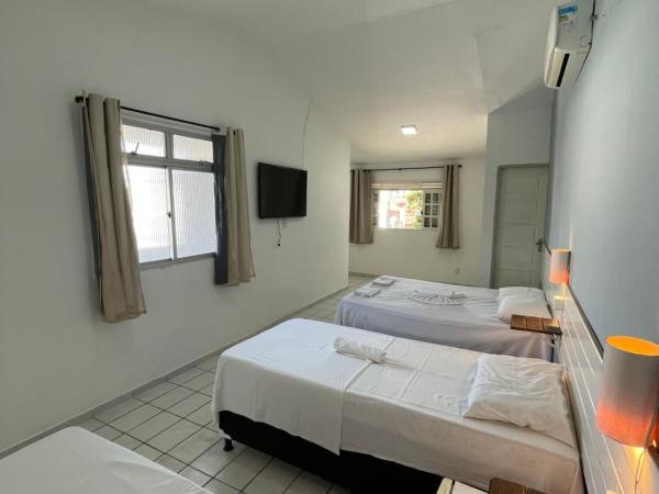 Pousada Encanto dos Mares : photo 2 de la chambre chambre quadruple