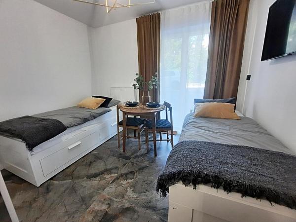 Royal Smart Apartments Cracow : photo 4 de la chambre chambre double ou lits jumeaux - vue sur jardin