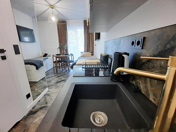 Royal Smart Apartments Cracow : photo 2 de la chambre chambre double ou lits jumeaux - vue sur jardin