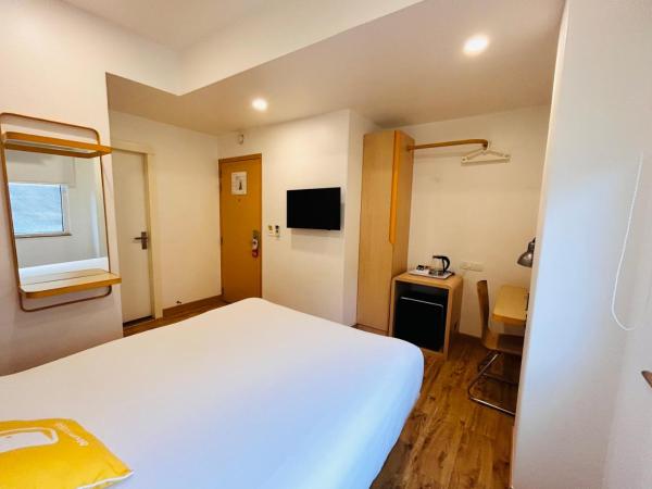 bloomrooms @ City Centre : photo 2 de la chambre chambre exécutive lit queen-size