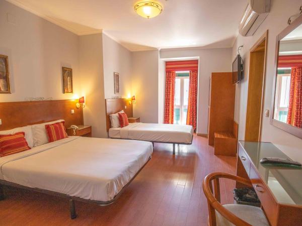 Grande Pensao Residencial Alcobia : photo 3 de la chambre chambre triple