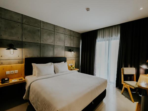 Ayaartta Hotel Malioboro : photo 1 de la chambre chambre double ou lits jumeaux deluxe avec balcon