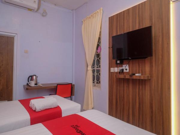 RedDoorz At Pondok Eyang Obi Sleman : photo 9 de la chambre chambre lits jumeaux deluxe