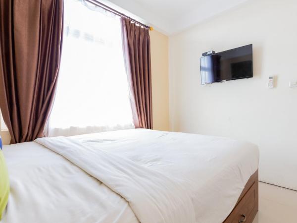 Urbanview Erga Family Residence Syariah Surabaya by RedDoorz : photo 5 de la chambre chambre supérieure lit queen-size