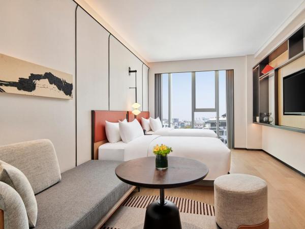 Artyzen Habitat Suzhou : photo 2 de la chambre habitat city view twin room
