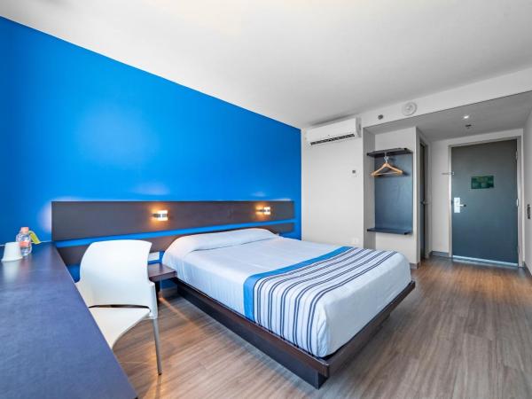 City Express Junior by Marriott Merida Altabrisa : photo 1 de la chambre chambre lit queen-size 