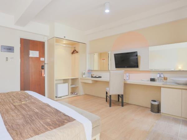 Hotel Gunawangsa Manyar : photo 2 de la chambre chambre deluxe double ou lits jumeaux