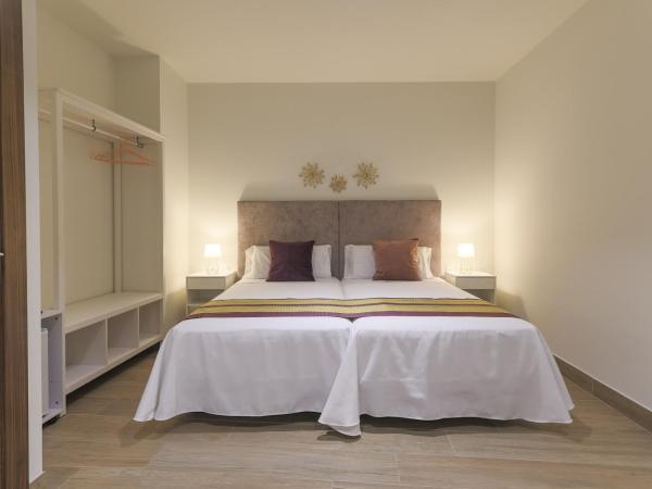 Dorinda Rooms : photo 6 de la chambre chambre triple supérieure