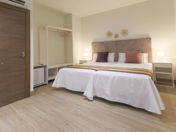 Dorinda Rooms : photo 9 de la chambre chambre triple supérieure