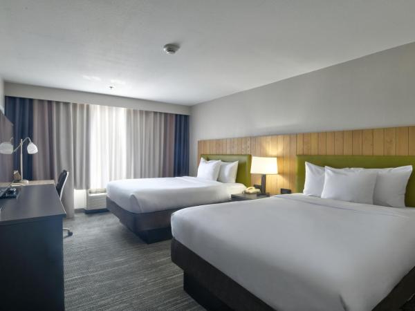 Country Inn & Suites by Radisson, Oklahoma City Airport, OK : photo 1 de la chambre chambre avec 2 grands lits queen-size