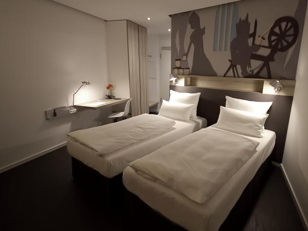 Grimm's Potsdamer Platz : photo 1 de la chambre chambre lits jumeaux