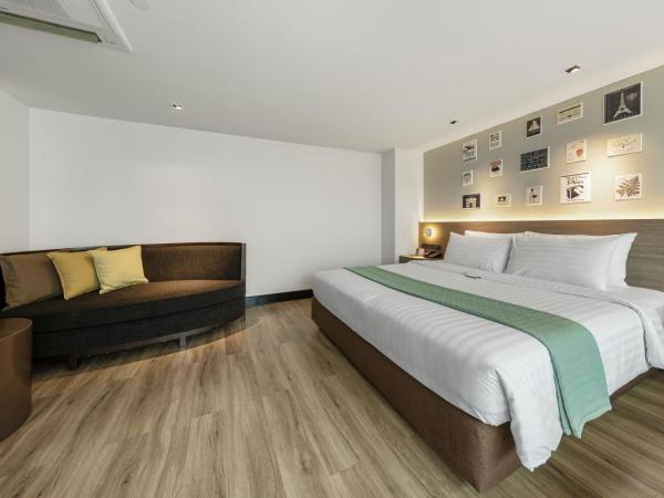 Golden Tulip Mandison Suites : photo 3 de la chambre suite lit king-size exécutive