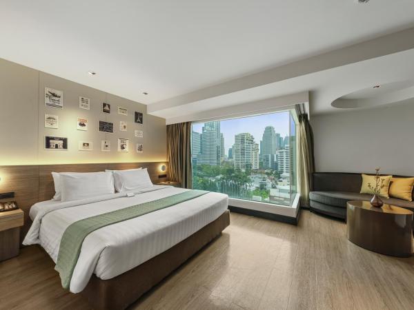 Golden Tulip Mandison Suites : photo 1 de la chambre grande chambre lit king-size deluxe