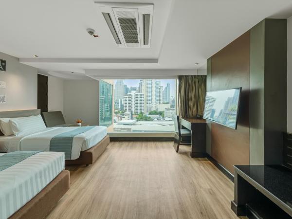 Golden Tulip Mandison Suites : photo 3 de la chambre chambre lits jumeaux deluxe