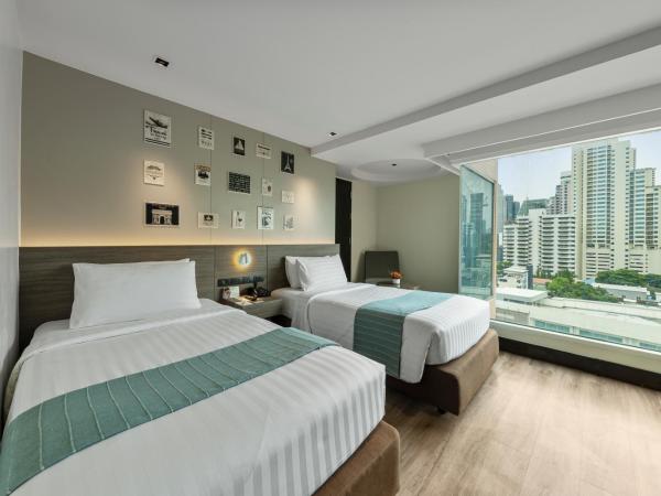 Golden Tulip Mandison Suites : photo 1 de la chambre chambre lits jumeaux deluxe