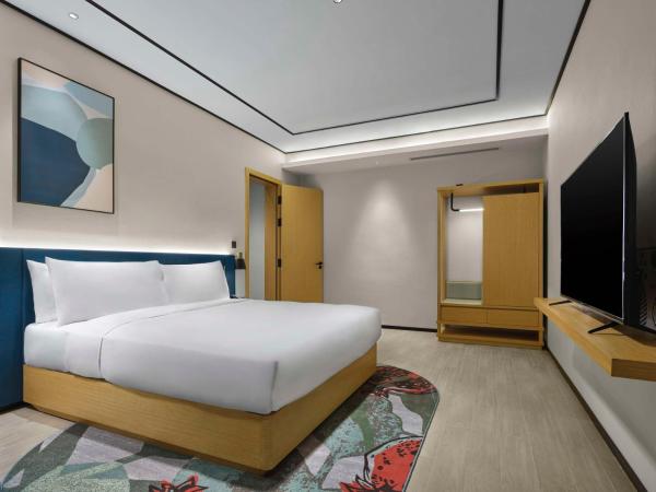 Hilton Garden Inn Tianjin Huayuan : photo 2 de la chambre suite premium lit king-size