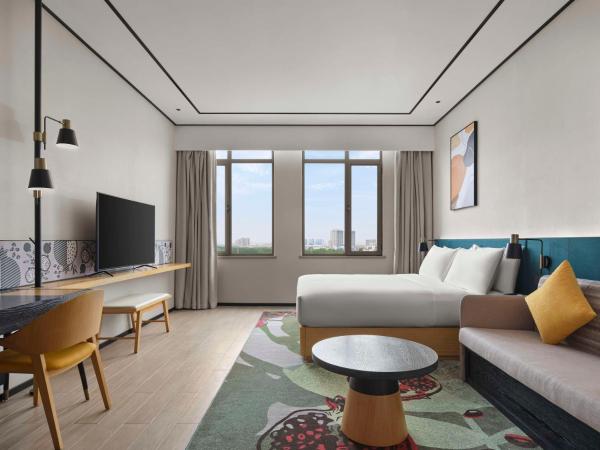 Hilton Garden Inn Tianjin Huayuan : photo 1 de la chambre chambre lit king-size