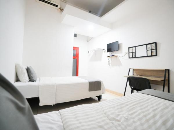 Griya Sawamah Syariah Mitra RedDoorz : photo 9 de la chambre chambre lits jumeaux