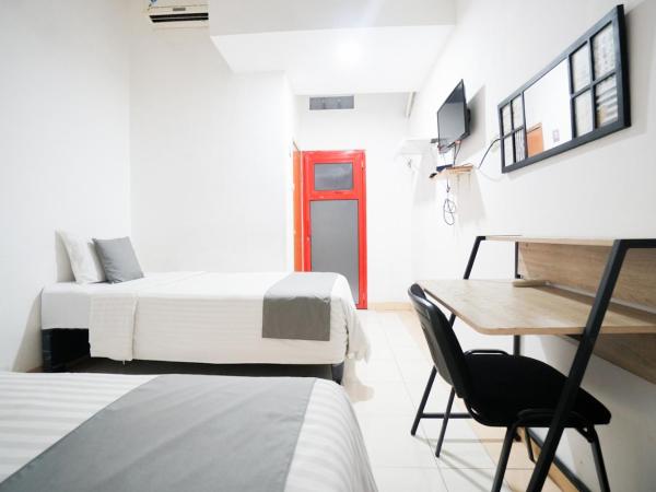 Griya Sawamah Syariah Mitra RedDoorz : photo 8 de la chambre chambre lits jumeaux