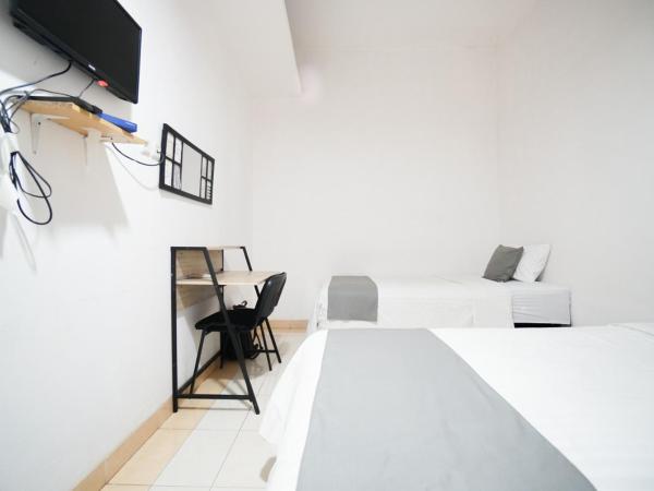Griya Sawamah Syariah Mitra RedDoorz : photo 5 de la chambre chambre lits jumeaux