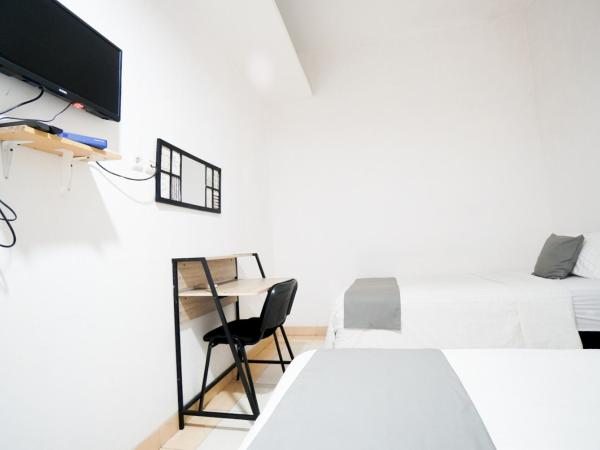 Griya Sawamah Syariah Mitra RedDoorz : photo 6 de la chambre chambre lits jumeaux