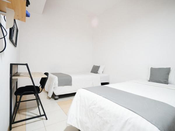 Griya Sawamah Syariah Mitra RedDoorz : photo 4 de la chambre chambre lits jumeaux