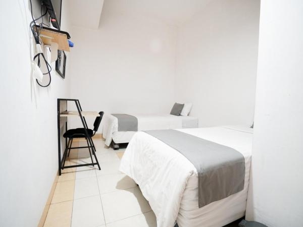 Griya Sawamah Syariah Mitra RedDoorz : photo 3 de la chambre chambre lits jumeaux