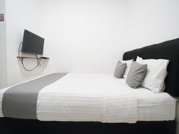 Griya Sawamah Syariah Mitra RedDoorz : photo 10 de la chambre chambre double standard