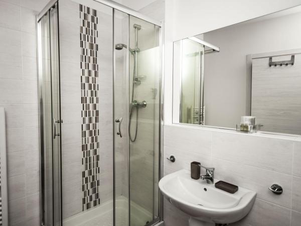 Il Tiro Rooms : photo 4 de la chambre chambre triple avec salle de bains privative