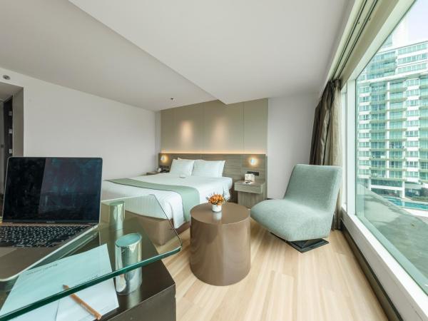 Golden Tulip Mandison Suites : photo 1 de la chambre chambre double deluxe