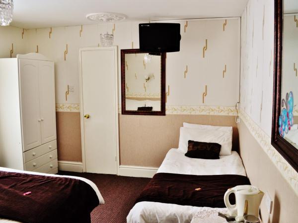 Cheers Hotel : photo 5 de la chambre chambre triple avec baignoire